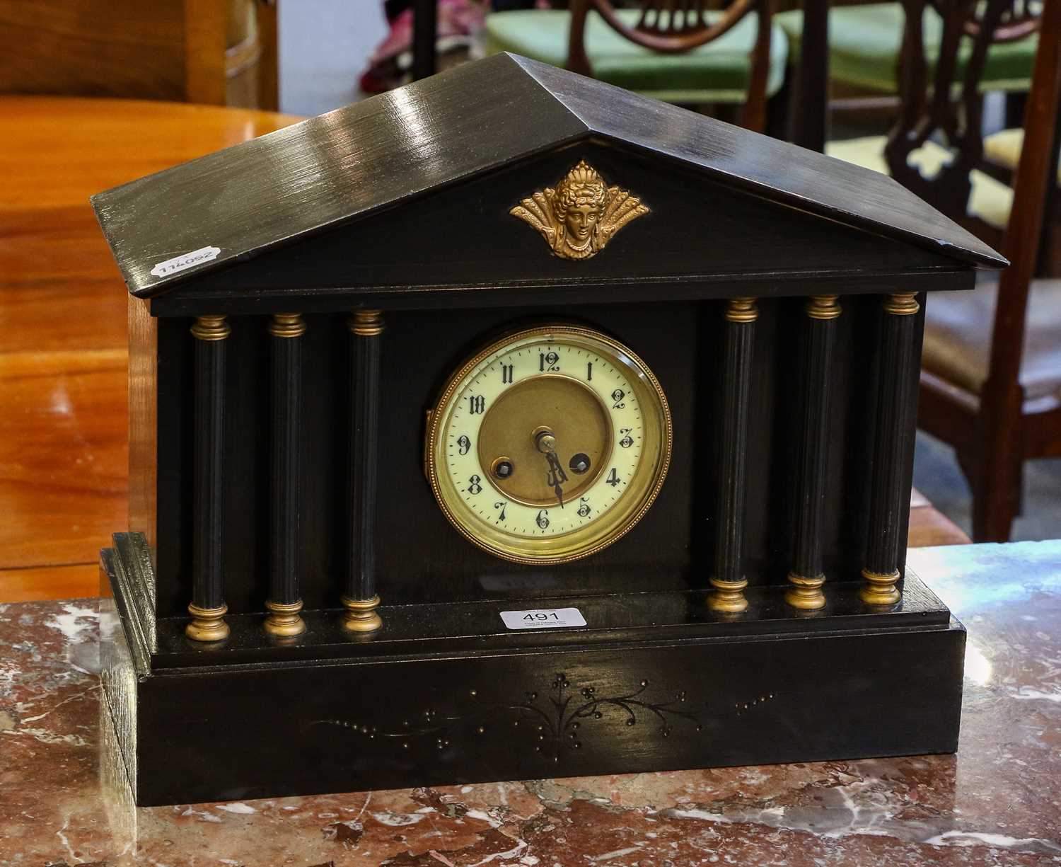 Lot 491 A striking slate mantel clock of