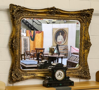 Lot 1415 - A large reproduction gilt mirror, the bevelled...