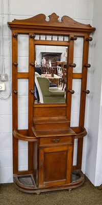 Lot 1192 - An Edwardian oak hall stand, with swan neck...