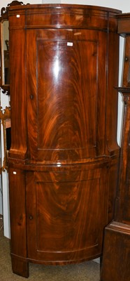 Lot 1301 - A Biedermeier mahogany bow fronted standing...