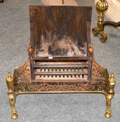 Lot 1137 - An Edwardian pierced brass and iron fire grate,...