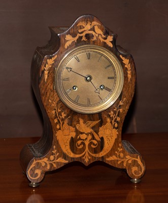 Lot 372 - A rosewood inlaid striking mantel clock, circa...