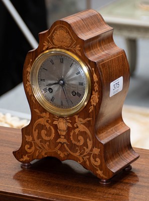 Lot 375 - A rosewood inlaid striking mantel clock, circa...