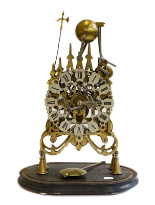 Lot 356 - A modern reproduction brass skeleton mantel...