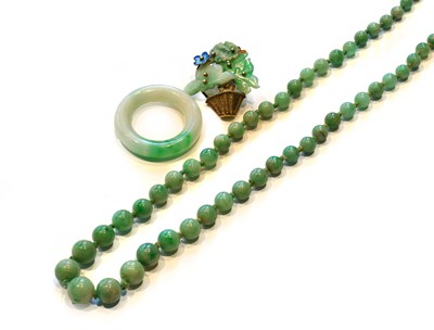 Lot 178 - A jade bead necklace, length 46cm; a jade ring,...
