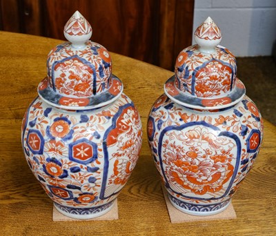 Lot 419 - Imari pattern pair of vases and covers