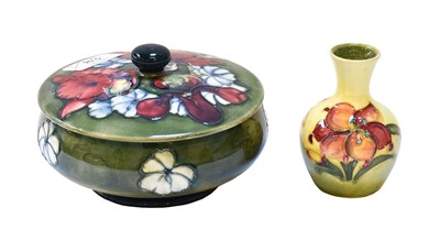 Lot 83 - A Moorcroft powder bowl and cover, Orchid and...