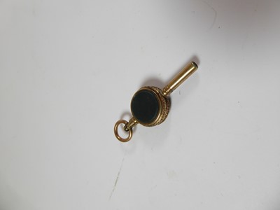 Lot 2063 - A Victorian Gold Fob-Seal, Three Gilt-Metal Fob or Desk Seals and Two Gilt Metal Watch-Keys