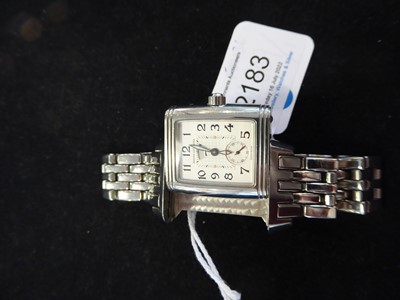 Lot 2183 - Jaeger LeCoultre: A Lady's Stainless Steel Night and Day Reverso Wristwatch