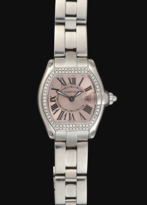 Lot 2187 - Cartier: A Lady's Stainless Steel Diamond Set Calendar Wristwatch