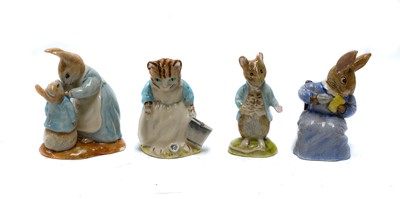 Lot 315 - Fourteen Beatrix Potter figures (boxed),...