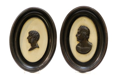 Lot 1323 - A pair of 19th-century bronze profile portrait...