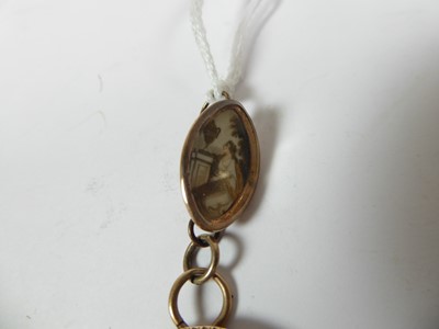 Lot 2048 - A Gold, Gilt-Metal and Pearl-Mounted Portrait Miniature Mourning-Pendant