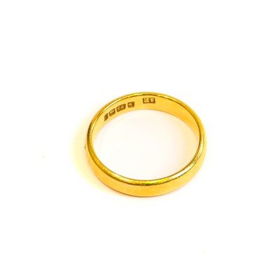 Lot 214 - A 22 carat gold band ring, finger size J