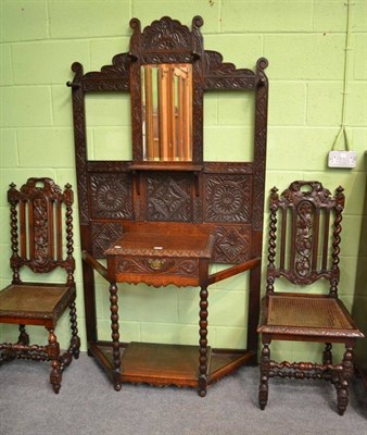 Lot 475 - Victorian carved oak hall stand and a pair of chairs with rush seats (3)