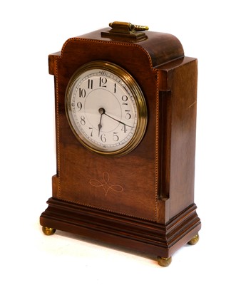Lot 102 - A mahogany inlaid mantel timepiece