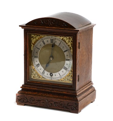 Lot 368 - An oak mantel timepiece, movement stamped W&H,...