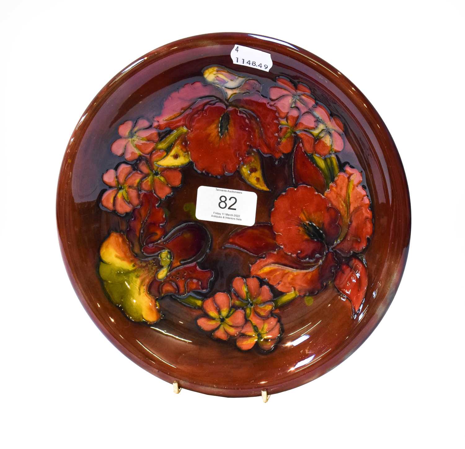 Lot 82 - A Walter Moorcroft flambe plate decorated with...