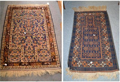 Lot 477 - Balouch prayer rug, West Afghanistan, the mid indigo field of angular vines and plants beneath...