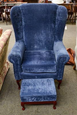 Lot 1258 - A blue upholstered wingback armchair and...