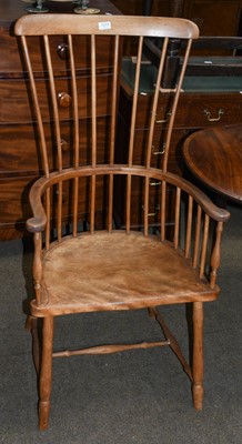 Lot 1274 - An early 20th century elm comb back Windsor chair