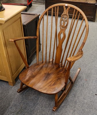 Lot 1126 - An Ercol elm rocking chair