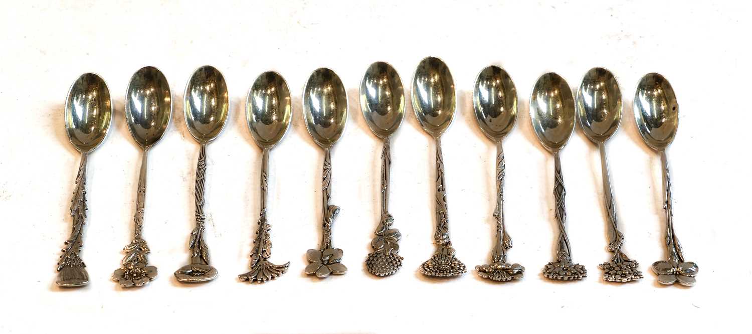Lot 164 - A set of eleven Tiffany floral demitasse spoons