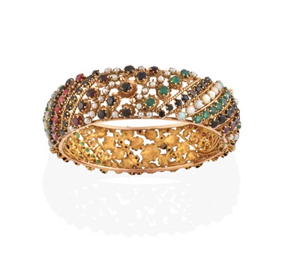 Lot 2345 - A Multi-Gem Set Hinged Bangle