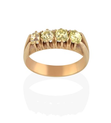 Lot 2338 - A Yellow Diamond Four Stone Ring