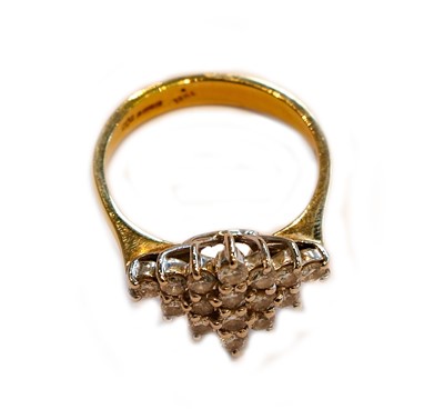 Lot 156 - An 18 carat gold diamond cluster ring, finger...