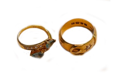 Lot 185 - An 18 carat gold buckle ring, finger size K1/2;...