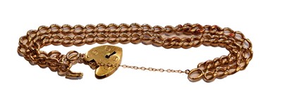 Lot 182 - A 9 carat gold double row curb link bracelet,...