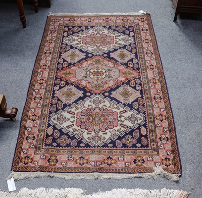Lot 1102 - A Shirvan design rug, the indigo field with...