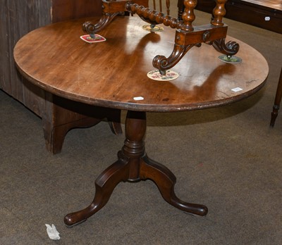 Lot 1285 - A Georgian mahogany circular tilt top tripod...