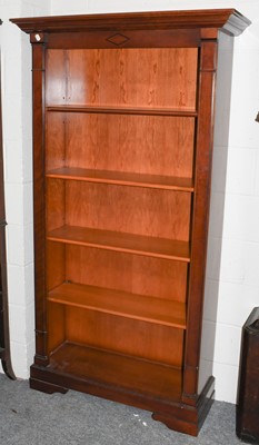 Lot 1076 - A pair of modern mahogany open bookcases,...