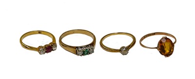 Lot 154 - A 9 carat gold diamond and emerald three stone...