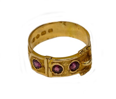 Lot 160 - An 18 carat gold garnet buckle motif ring,...