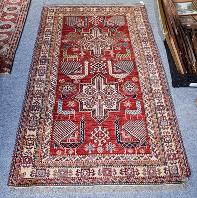 Lot 1107 - Afghan rug, the strawberry field with fan tail...