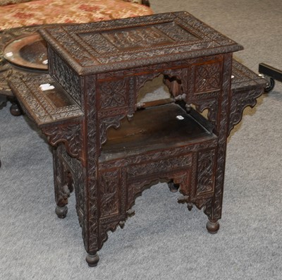 Lot 1073 - A 19th Anglo-Indian ornately carved side table...