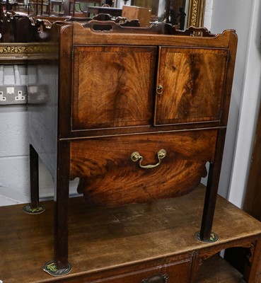 Lot 1198 - A George III mahogany washstand with hinged...