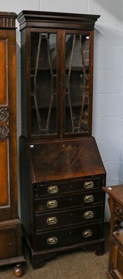 Lot 1200 - A George III mahogany bureau bookcase of...