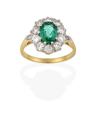 Lot 2418 - An Emerald and Diamond Cluster Ring