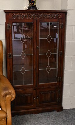 Lot 1110 - A pair of 20th century leaded and carved oak...