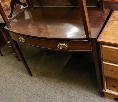 Lot 1213 - A George III mahogany bowfront writing table,...