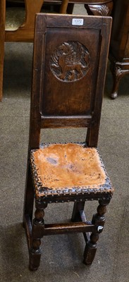 Lot 1372 - An 18th century oak correction chair, the...