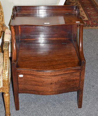 Lot 1297 - A George III mahogany commode of two-tier form,...