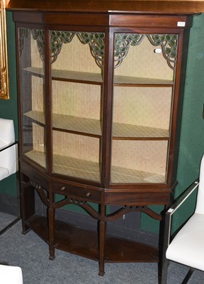 Lot 1135 - An Art Noveau mahogany display cabinet, with...