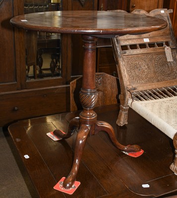 Lot 1293 - George III mahogany flip top tripod table, the...