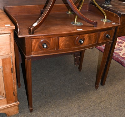 Lot 1216 - A George IV mahogany bow fronted wash stand,...