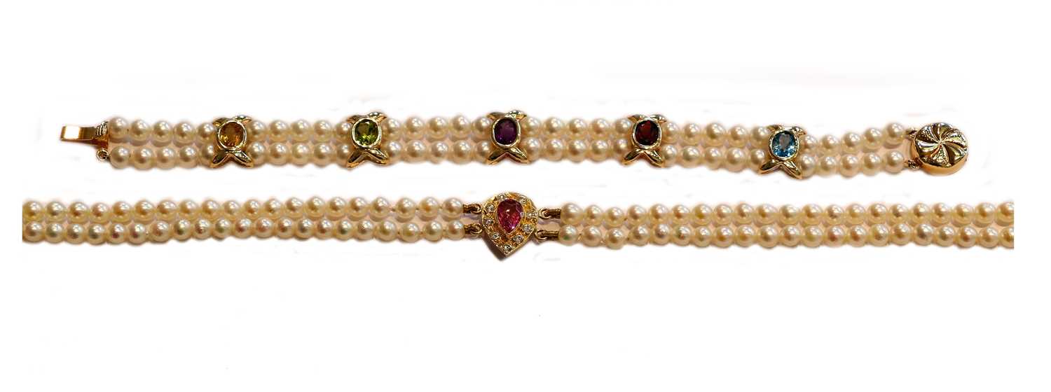 Lot 163 - A pink tourmaline and diamond two row cultured...